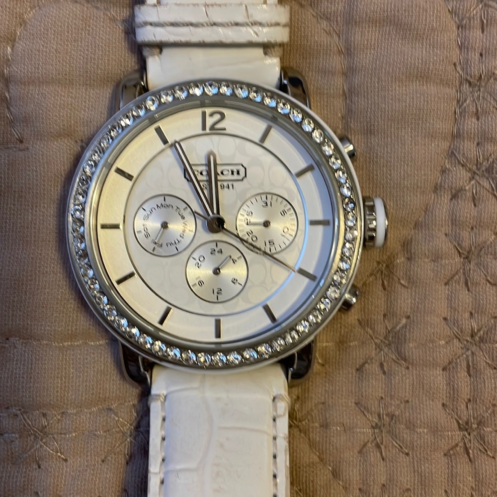 Coach watch w/ white leather strap and rhinestones around dial
